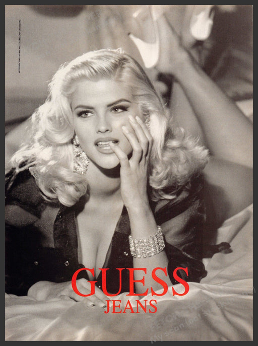 Guess 1990s Print Advertisement 1993 Anna Nicole Smith Finger Mouth Bed Guess