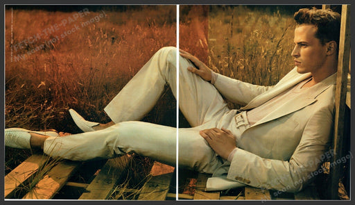 Hugo Boss 2000s Print Advertisement (2 pages) 2005 Male Model Suit Lounging Fetch-the-Paper