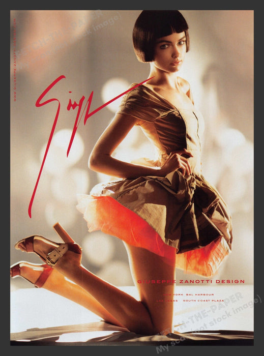 Giuseppe Zanotti 2000s Print Advertisement 2007 Long Legs Skirt Kneeling Heels Fetch the Paper!