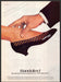 Bandolino Shoes 1980s Print Advertisement 1982 Touching the Foot Fetch-the-Paper