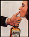 Cointreau 1980s Print Advertisement Ad 1984 Woman Kissing Thumb Fetch-the-Paper
