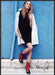Franco Sarto Shoes 2010s Print Advertisement 2012 Model Posing Against Blue Wall Fetch-the-Paper