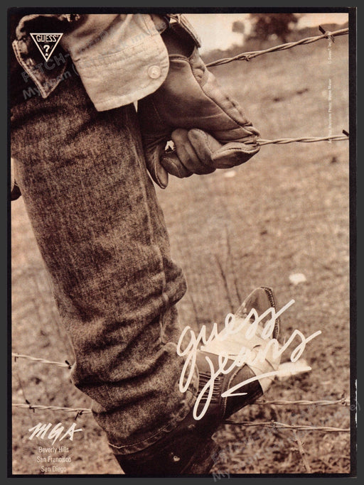 Guess Jeans 1980s Print Advertisement 1986 Cowboy Barbed Wire Fencing Fetch-the-Paper