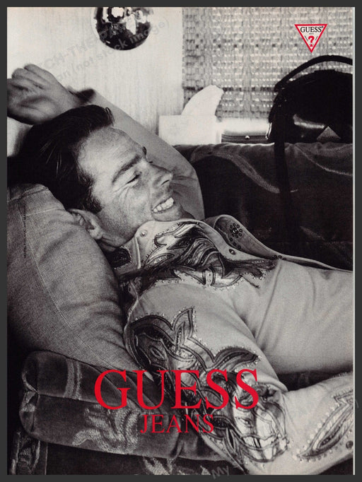 Guess Jeans 1990s Print Advertisement Ad 1992 Male Model on Couch Fetch-the-Paper