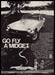 MG Midget 1970s Print Advertisement 1977 "Go fly a Midget" Car Park Couple MG Midget