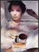 Prada 2000s Print Advertisement 2005 Perfume Model Lounging with Hair Up Prada
