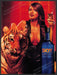 Skyy Spiced #20 "Tigress" 2000s Print Advertisement 2003 Model & Tiger Fetch-the-Paper