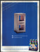St. Pauli Girl 2000s Print Advertisement 2003 Cement Block Fetch-the-Paper