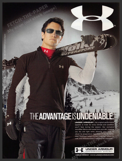 Under Armour 2000s Print Advertisement 2005 Downhill Skier Snow Fetch-the-Paper