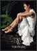 Vera Wang 2010s Print Advertisement 2013 Legs Folded Sitting on Log Fetch-the-Paper