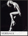 Versace Shoes January Jones 2010s Print Advertisement 2011 Legs Bare Body Fetch-the-Paper