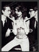 bebe 2000s Print Advertisement 2002 Olga Kurylenko Two Men Fetch the Paper!