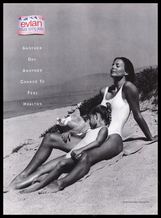 Evian Water 1990s Print Advertisement Ad 1995 Mom & Daughter in Sand Fetch the Paper!