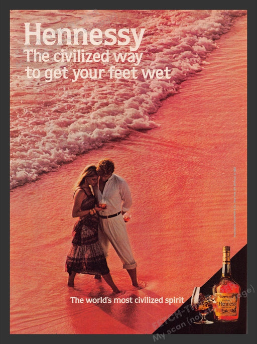 1984 Hennessy Cognac Couple on Beach with Waves Print Advertisement Ad