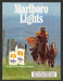 1986 Marlboro Lights Cowboy Riding the Fence Line Print Advertisement Ad
