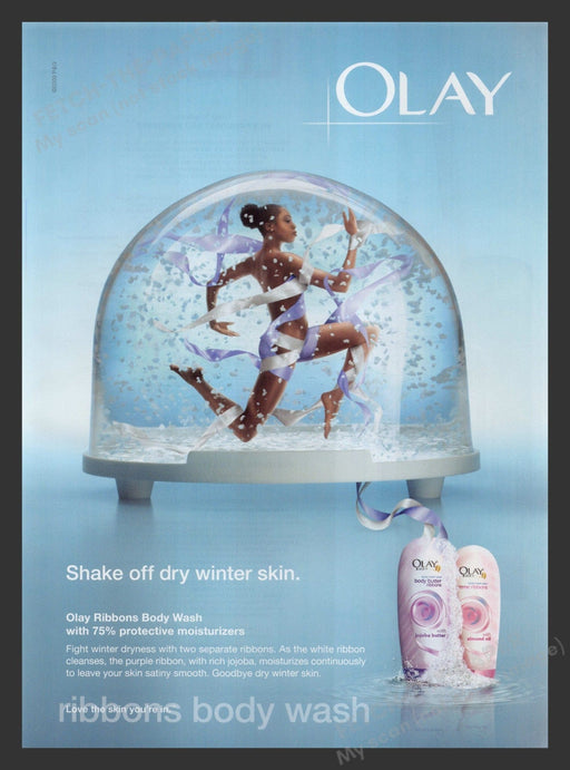 Olay 2000s Print Advertisement 2009 Ribbons Body Wash Female in Snow Globe Fetch the Paper!