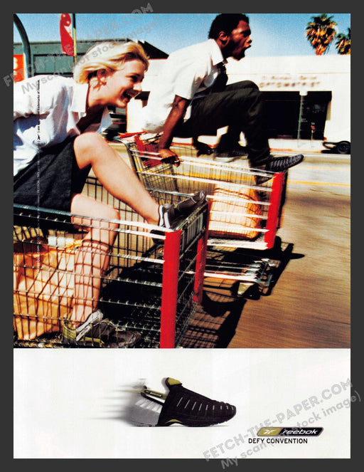 2001 Print Advertisement Reebok Shoes Defy Convention Shopping Cart Race Ad.